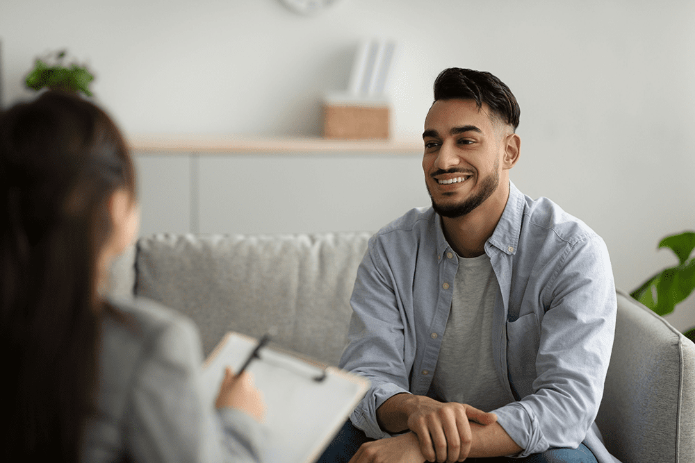therapist explaining How a Men’s Intensive Outpatient Program Supports Recovery
