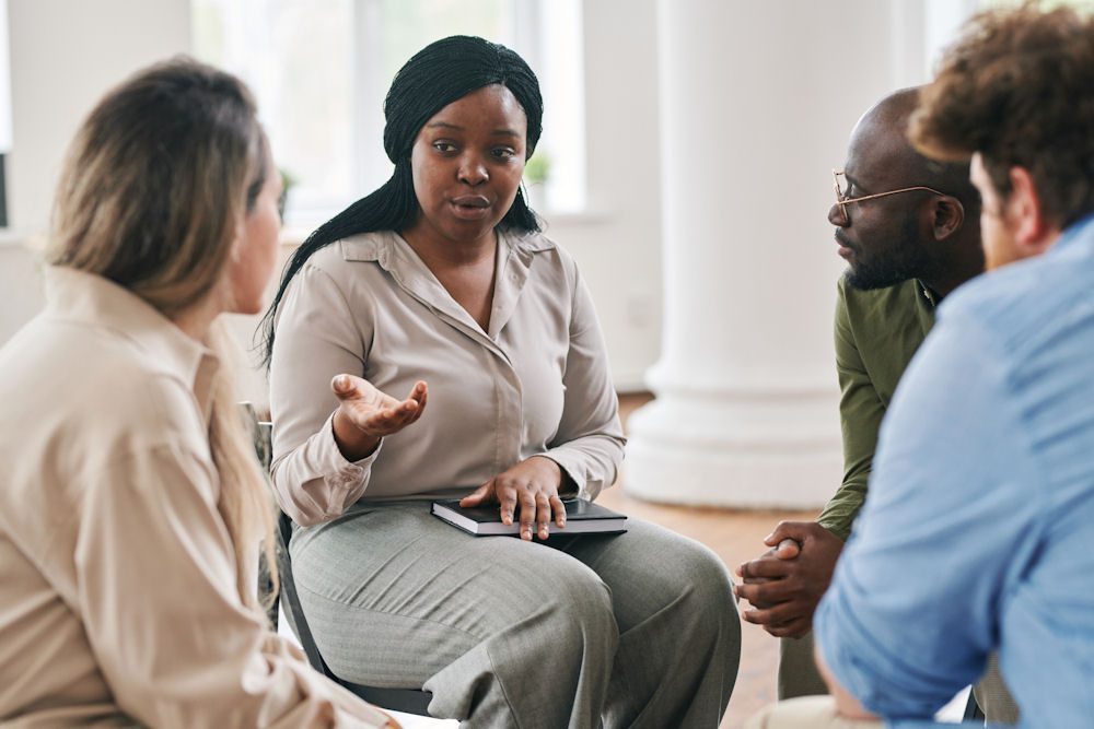 an instructor leading the group therapy session