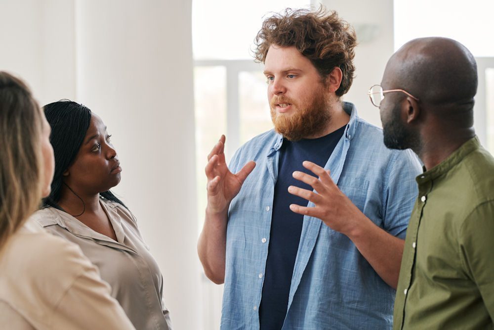 a man sharing his feelings in a group session